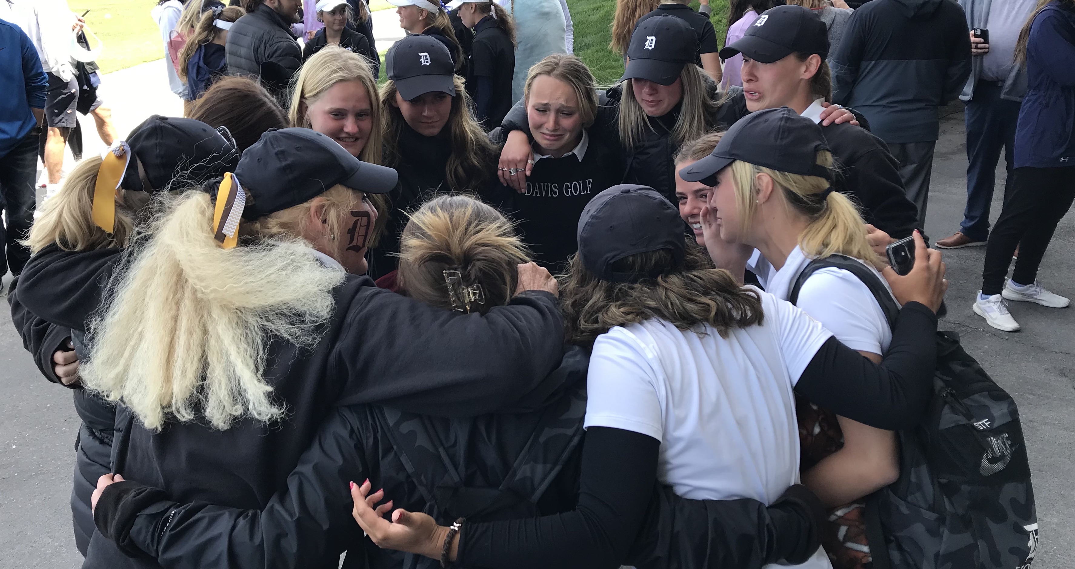 Davis High's girls golf team huddles up after hearing their name's called as 2021 Class 6A girls golf state champions, Tuesday, May 11, 2021 at The Ridge in West Valley.