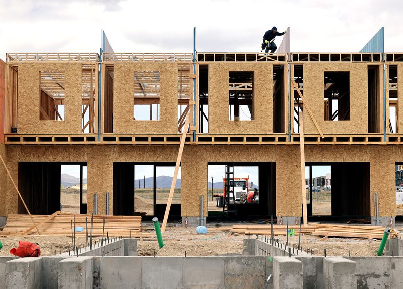 Home builders work at a building site in South Jordan
on Monday, May 10, 2021. Unprecedented increases in the cost of
lumber and other building supplies is driving up prices in Utah’s
already red-hot real estate and renovation markets.