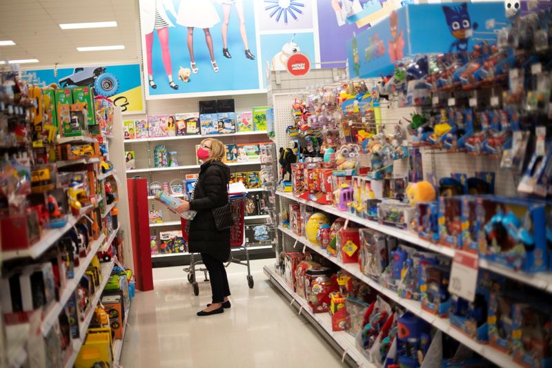 FILE PHOTO: A shopper wearing a face mask due to the coronavirus disease (COVID-19) pandemic browses toys at a Target store in King of Prussia, Pennsylvania U.S. November 20, 2020. REUTERS/Mark Makela