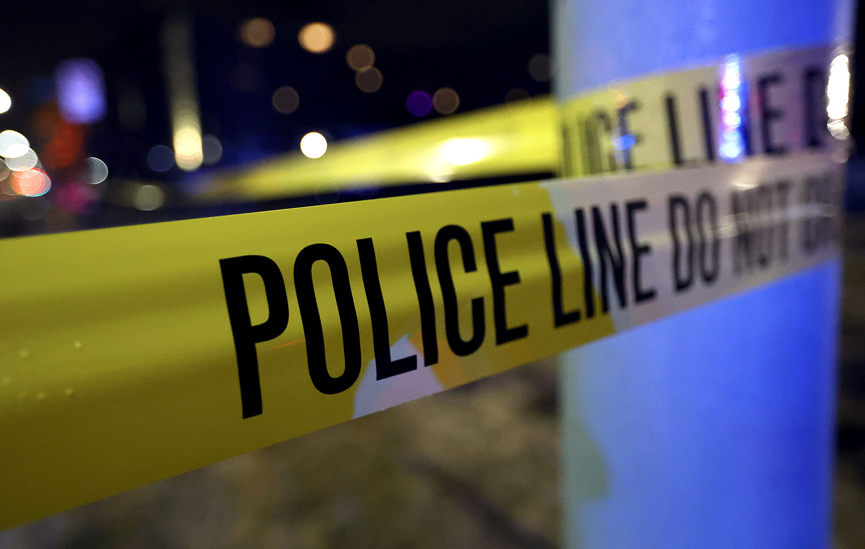 Police tape hangs at the scene of a crime in Salt Lake City in this March 15, 2021, file photo.