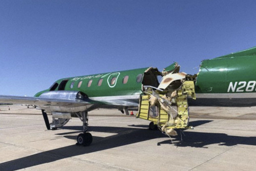 This image from CBS Denver shows a Key Lime Air Metroliner that landed safely at Centennial Airport after a mid-air collision near Denver on Wednesday, May 12, 2021. Federal officials say two airplanes collided but that there are no injuries. The collision between a twin-engine Fairchild Metroliner and a single-engine Cirrus SR22 happened as both planes were landing, according to the National Transportation Safety Board. Key Lime Air, which owns the Metroliner, says its aircraft sustained substantial damage to the tail section but that the pilot was able to land safely. (CBS Denver via AP)