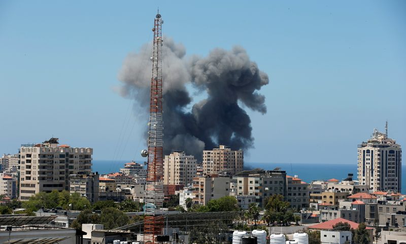 Smoke rises during an Israeli air strike, amid a flare-up of Israeli-Palestinian violence, in Gaza City May 13, 2021. REUTERS/Suhaib Salem