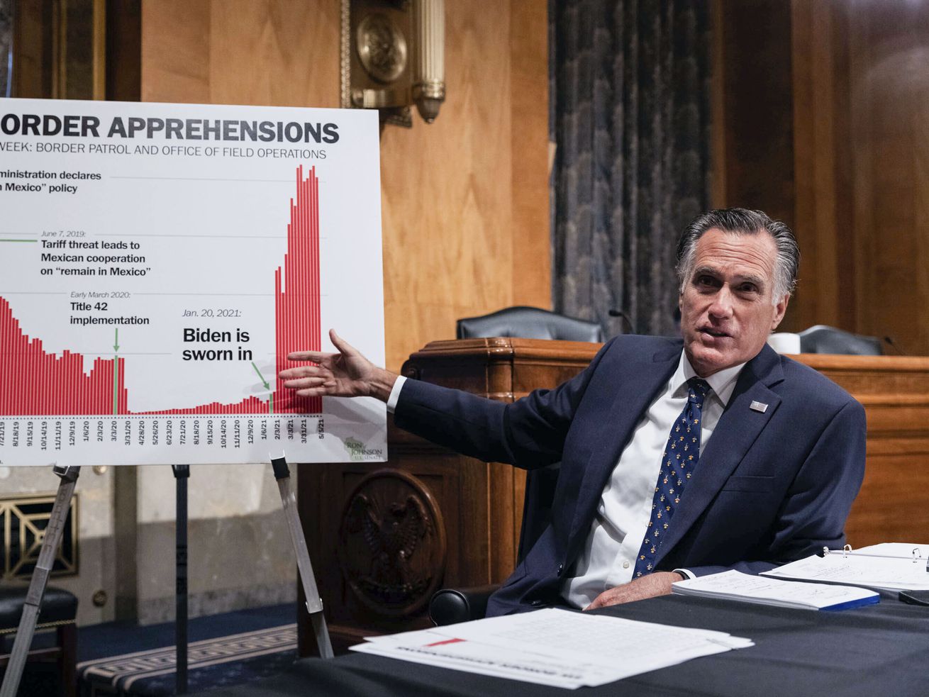 Sen. Mitt Romney, R-Utah, points to a chart as he
speaks during a Senate Homeland Security and Government Affairs
Committee hearing on Capitol Hill in Washington on Thursday, May
13, 2021.