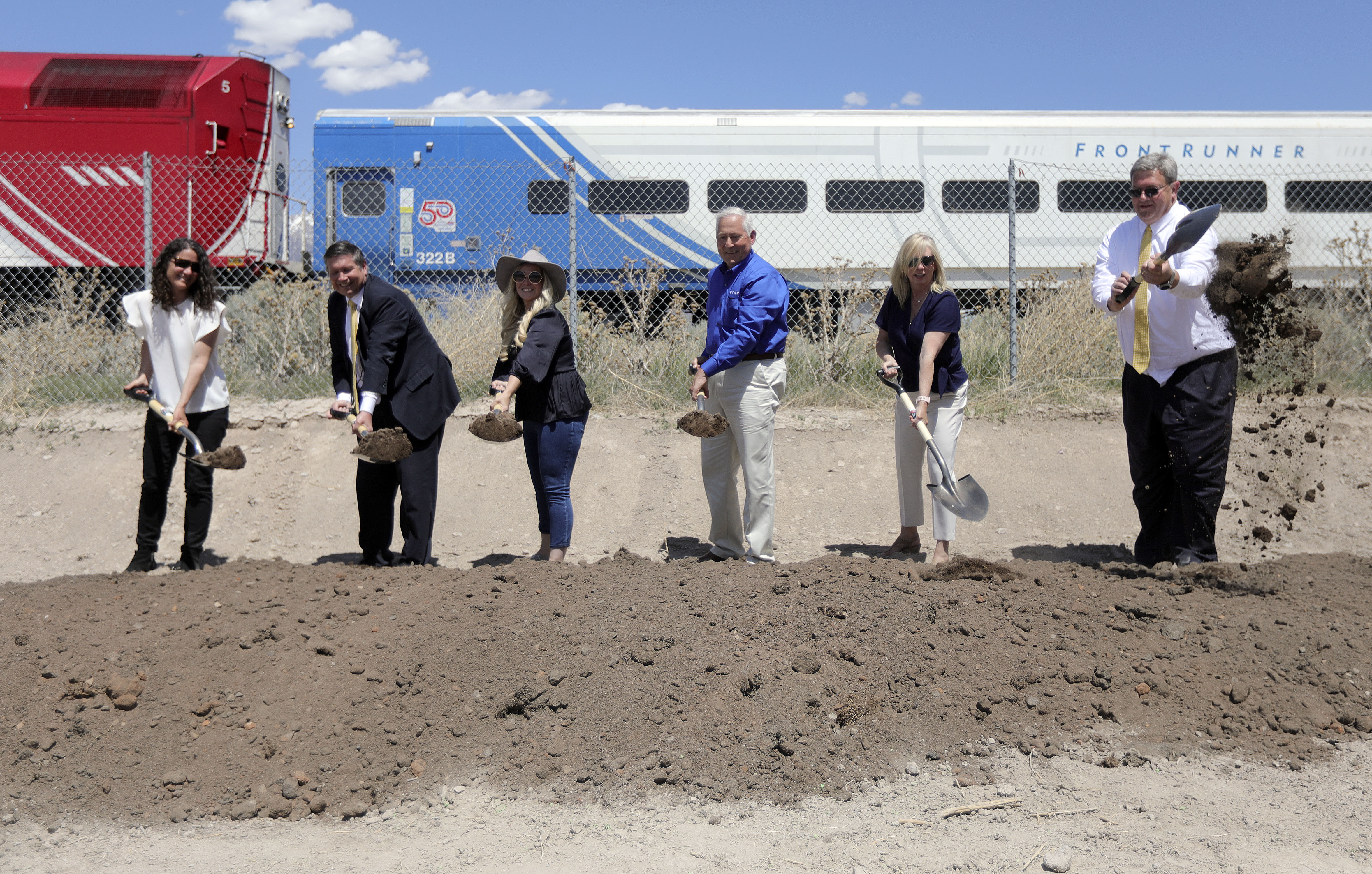 Teri Newell, deputy director of planning and investment for the Utah Department of Transportation, left, state Rep. Val Peterson, Utah Valley University vice president for finance and administration, Vineyard Mayor Julie Fullmer, Utah Transit Authority trustees Jeff Acerson and Beth Holbrook, and UTA board Chairman Carlton Christensen ceremonially break ground at the site of a future FrontRunner station in Vineyard on Thursday, May 13, 2021.