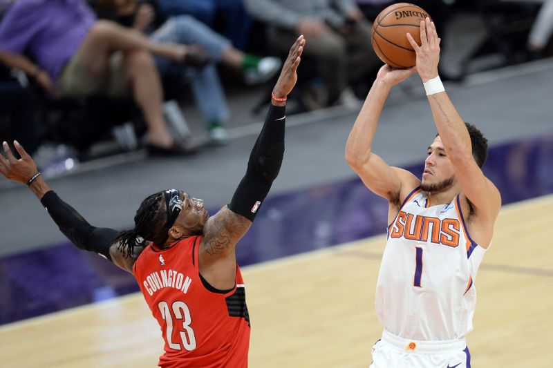 May 13, 2021; Phoenix, Arizona, USA; Phoenix Suns guard Devin Booker (1) shoots over Portland Trail Blazers forward Robert Covington (23) during the second half at Phoenix Suns Arena. Mandatory Credit: Joe Camporeale-USA TODAY Sports