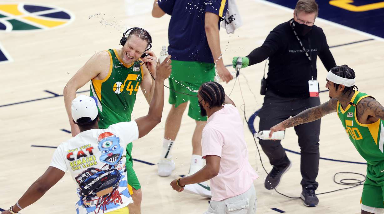 Utah Jazz forward Bojan Bogdanovic (44) is hit with water from Utah Jazz guard Donovan Mitchell (45), Utah Jazz guard Mike Conley (10) and Utah Jazz guard Jordan Clarkson (00) as Utah Jazz defeat the Denver Nuggets in an NBA basketball game at Vivint Arena in Salt Lake City on Friday, May 7, 2021. Utah won 127-120.