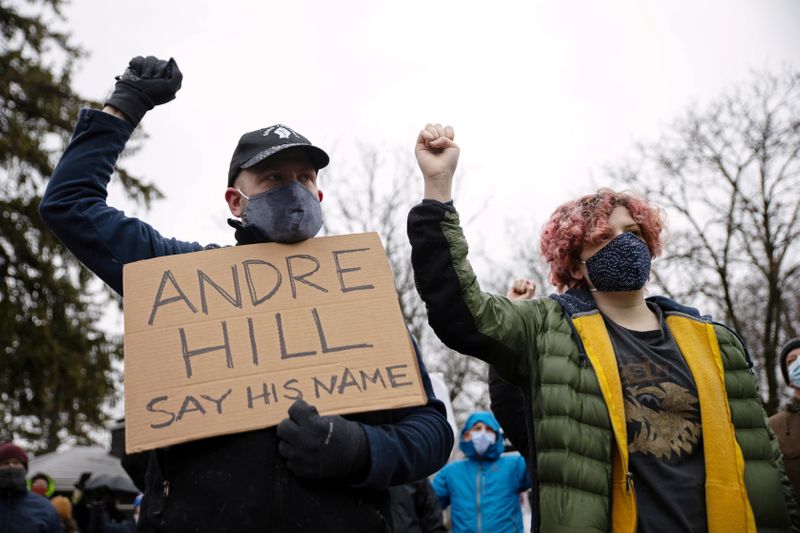 FILE PHOTO: Protesters gather outside the home where Andre Maurice Hill, 47, was killed in Columbus, Ohio, U.S., December 24, 2020.  REUTERS/Megan Jelinger/File Photo