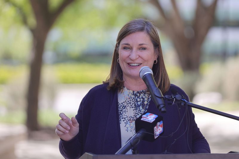 Salt Lake County Mayor Jenny Wilson smiles while not
wearing a mask during a press conference at the Salt Lake County
Government Center in Salt Lake City on Friday, May 14, 2021. County
officials announced fully vaccinated people can go without masks in
county-owned facilities.