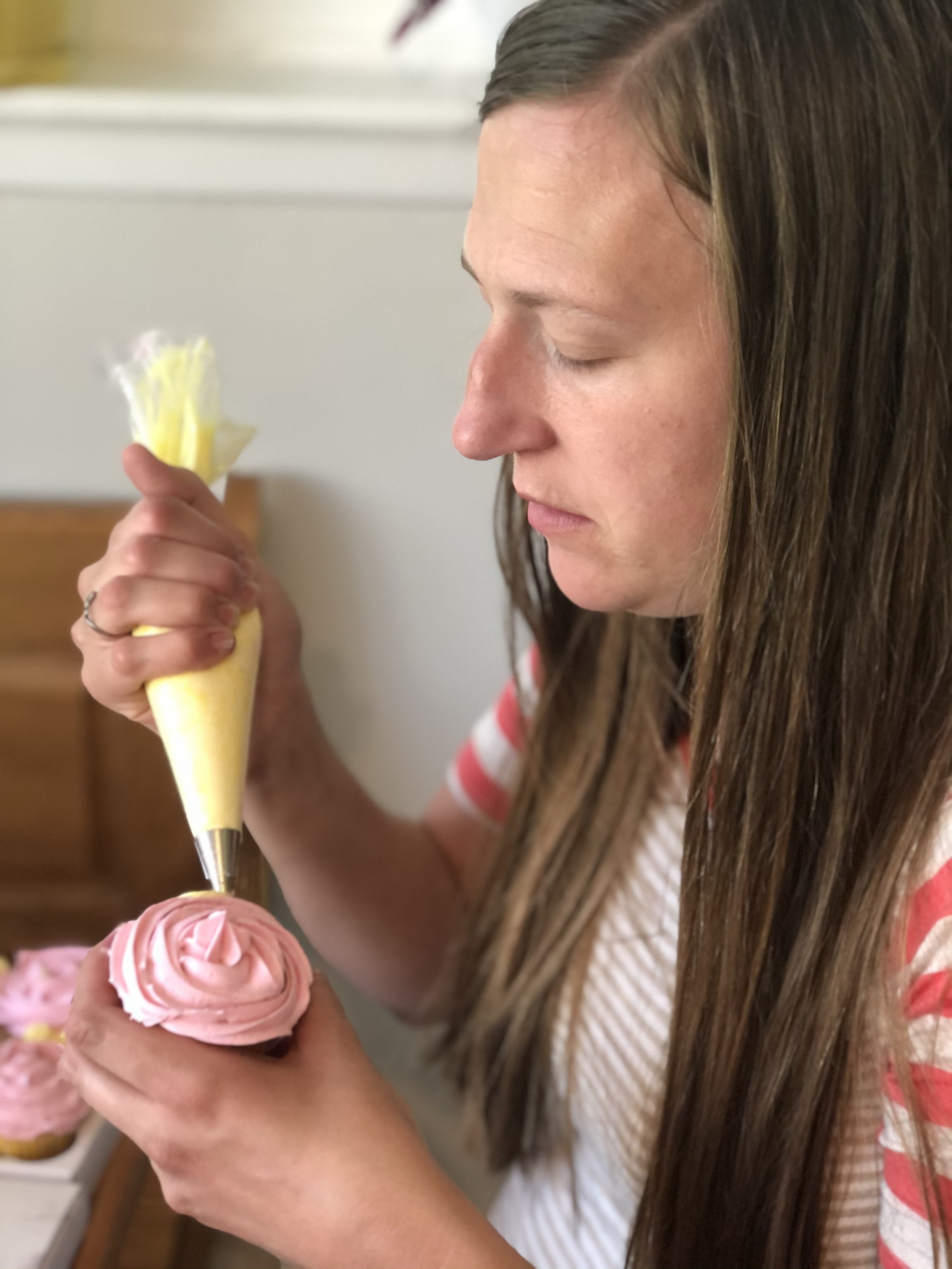 Elise Dearing decorates birthday cupcakes for an underserved child as part of a new nonprofit organization, Cake4Kids.