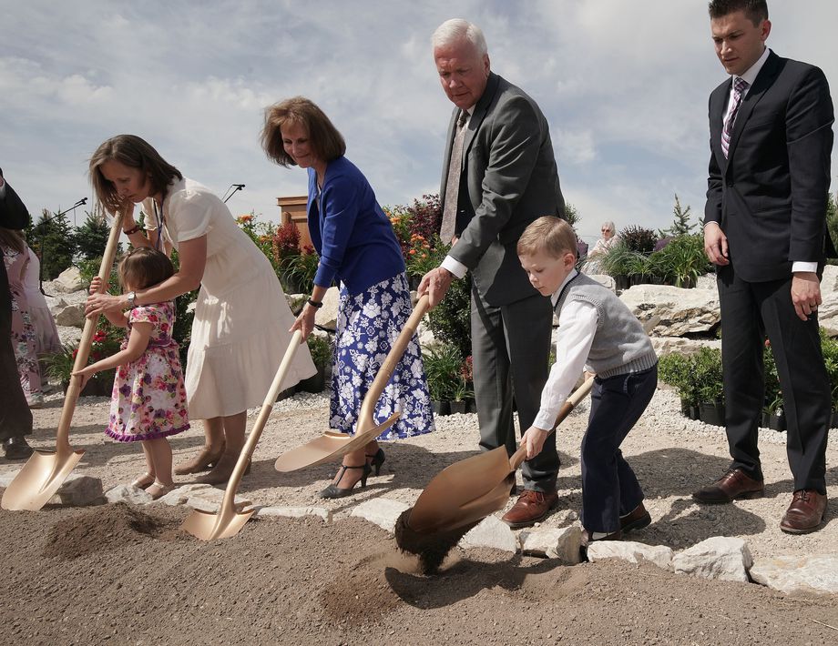Elder Brook P. Hales of the Seventy turns over dirt with grandson Clark Hales, 4, during the Deseret Peak Utah Temple groundbreaking in Tooele, Utah, on Saturday, May 15, 2021.