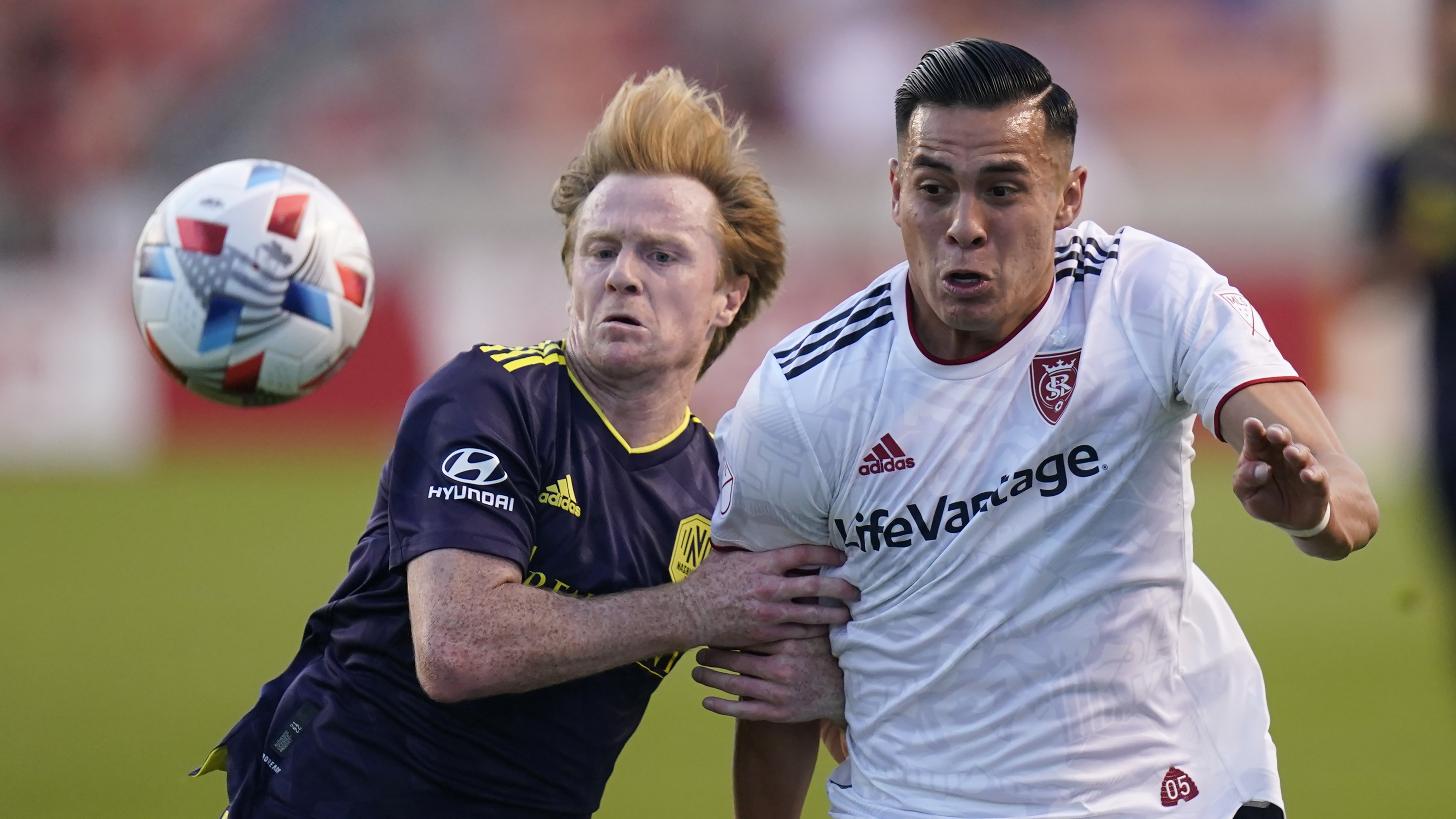 Nashville SC midfielder Dax McCarty, left, and Real Salt Lake forward Rubio Rubin, right, battle for the ball in the first half during an MLS soccer match Saturday, May 15, 2021, in Salt Lake City.