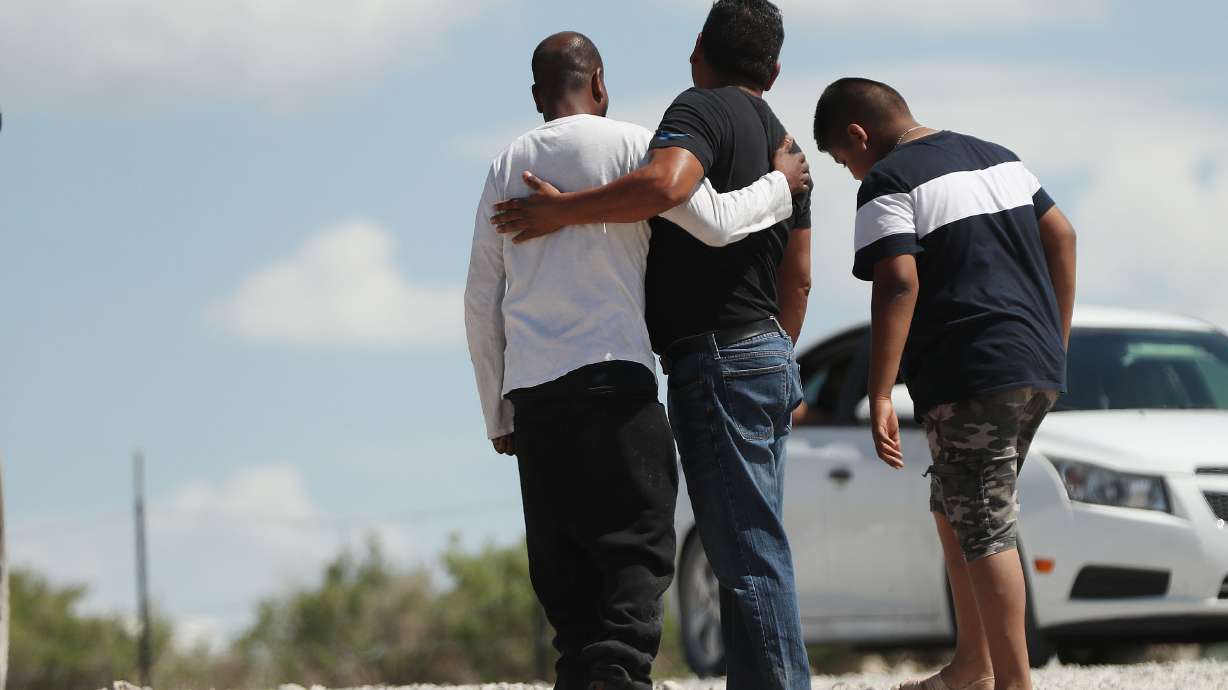Family and friends mourn as search and rescue members find two missing jet skiers at The Knolls on Utah Lake on Sunday, May 16, 2021.