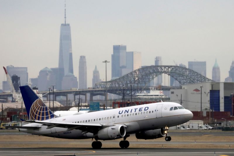 FILE PHOTO: A United Airlines passenger jet takes off with New York City as a backdrop, at Newark Liberty International Airport, New Jersey, U.S. December 6, 2019. REUTERS/Chris Helgren/File Photo  GLOBAL BUSINESS WEEK AHEAD/File Photo