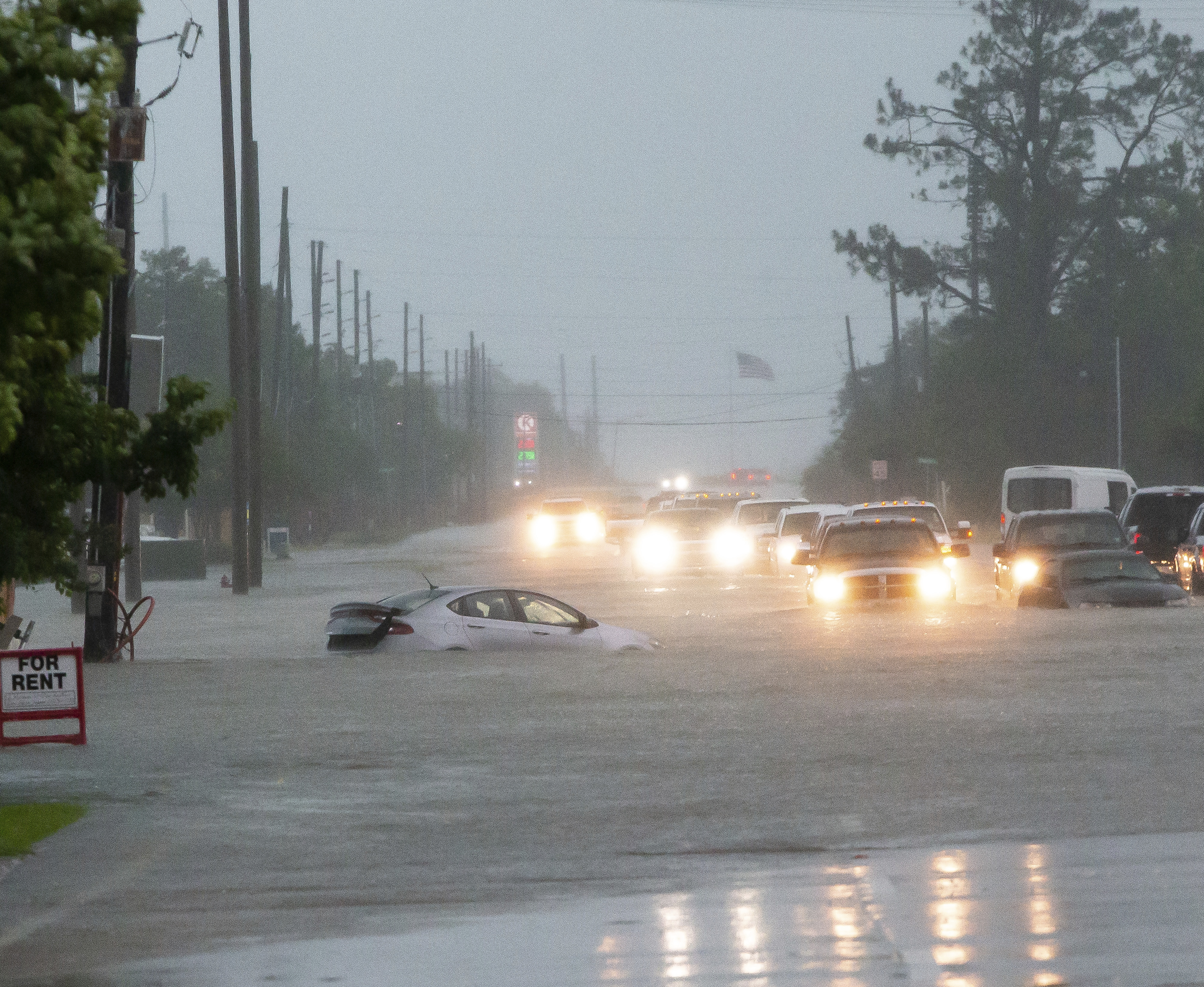 Cars sit stalled on a flooded Nelson Road from heavy rains in Lake Charles, La., Monday, May 17, 2021. (Rick Hickman/American Press via AP) [May-17-2021]