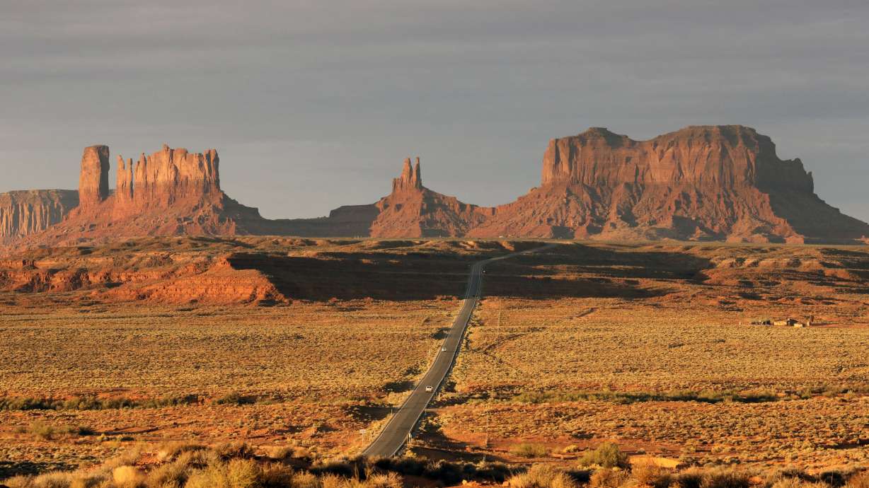 FILE - In this Oct. 25, 2018 file photo, Monument Valley is shown in Utah. The Navajo Nation has by far the largest land mass of any Native American tribe in the country. Now, it's boasting the largest enrolled population, too. The number grew to nearly 400,000 because of payments made to individual Navajos for hardships during the pandemic. The tribe now tops the Cherokee Nation's enrollment of 392,000, but a tribal spokeswoman says the Oklahoma tribe also is growing. (AP Photo/Rick Bowmer, File)