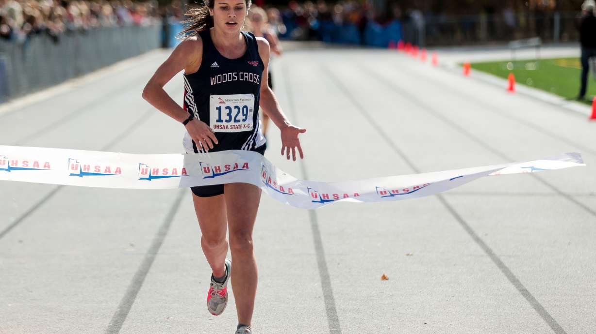 Carlee Hansen of Woods Cross places first in the 5A Girls State Cross-Country Championships at Highland High School in Salt Lake City on Wednesday, Oct. 23, 2019.