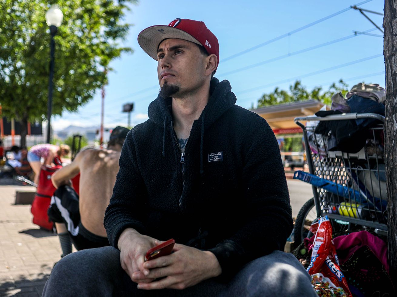 Roberto, who declined to give a last name, poses for a
photo near the Red Iguana off of North Temple in Salt Lake City on
Tuesday May 18, 2021. Roberto is formerly homeless and struggled
with addiction to heroin starting in approximately 2011 and
continuing to 2018. In 2018 he decided to "clean up his life after
eight to nine times.” He was prescribed a Sublocade injection that
helped him curb his addiction, save up money, enter a relationship
and secure a car and apartment. "I have a hard time leaving even
though I have a place at home, I have a car,” Roberto said. "I have
a hard leaving because I know people out here and I know the
struggle. I know when you’re in that addiction it’s hard to get out
of it.” Roberto noted that Utah is a good state for resources, but
often those struggling with mental illness and addiction aren’t
finding support and need more help. "I come out here and try to,
just say 'hi,’ give a little hope to some people I know and even
though they hear it a lot, I kind of got them, getting them help at
the VOA. I know that they don’t want to be out here. ... I try to
offer some of my good buddies clothing, a place to shower. ... I
try to offer hope.”