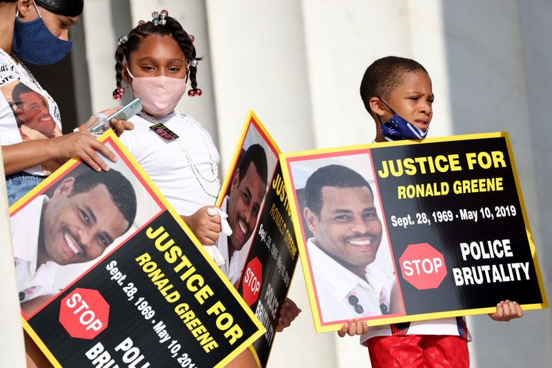 FILE PHOTO: Family members of Ronald Greene listen to speakers as they gather at the Lincoln Memorial during the 'Get Your Knee Off Our Necks' march in support of racial justice in Washington, U.S., August 28, 2020. Michael M. Santiago/Pool via REUTERS