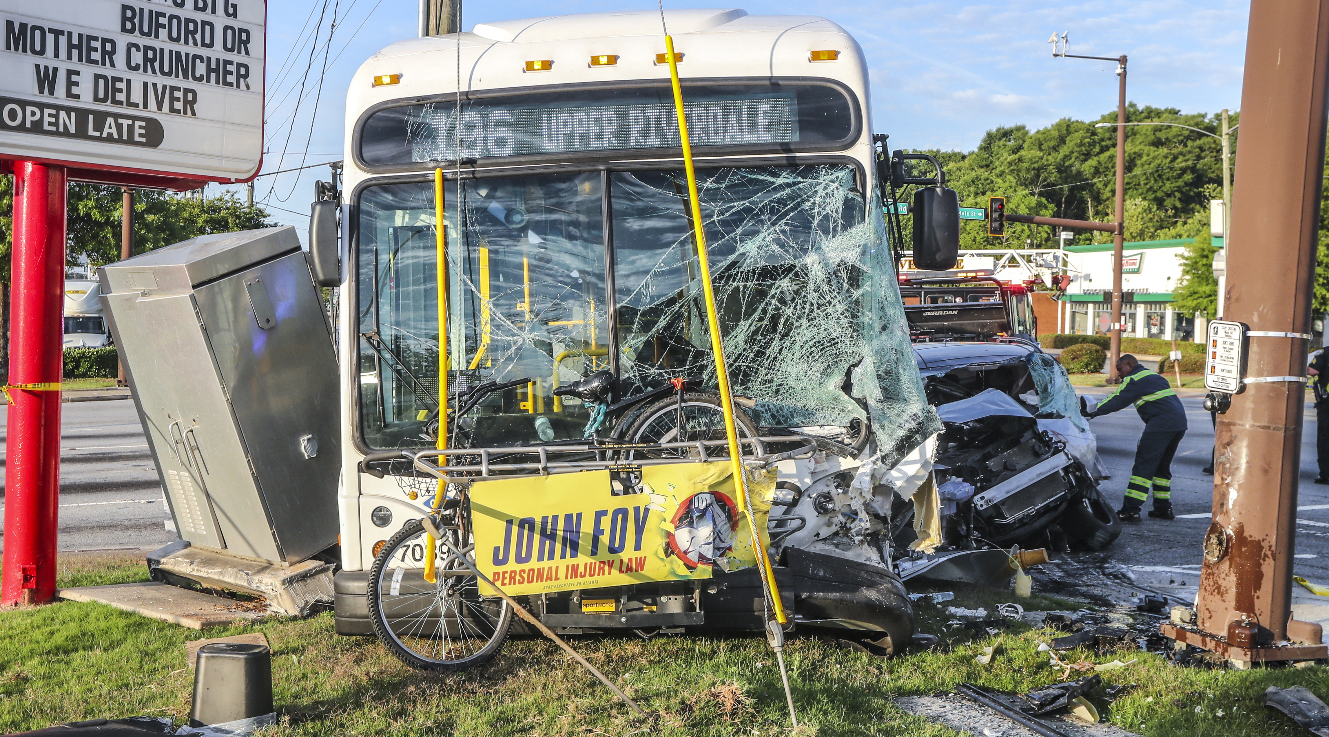 Car crashes into Atlanta bus, shuts down busy intersection