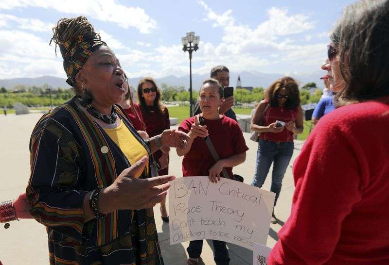 Betty Sawyer, left, a supporter of critical race theory, exchanges views with a group of women opposed to the theory, after a protest organized by the Utah Educational Equity Coalition outside of the Capitol in Salt Lake City on Wednesday, May 19, 2021. Community activists and educators protested Utah lawmakers’ plans to pass resolutions encouraging a ban of critical race theory concepts in an extraordinary session scheduled later Wednesday.