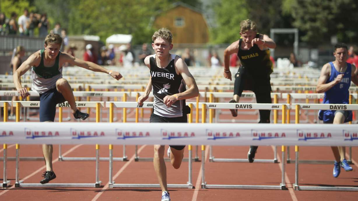 Boys compete in the 6A 110-meter hurdles at Davis High School in Kaysville on Wednesday, May 19, 2021.