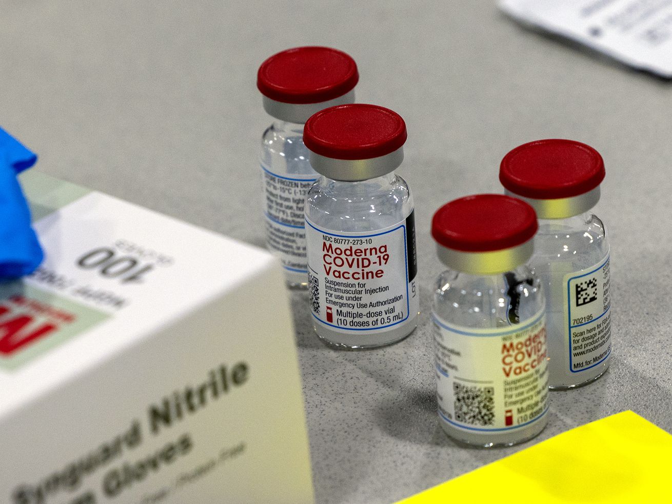 Vials of Moderna’s COVID-19 vaccines sit on a table at
the Mountain America Exposition Center in Sandy on Tuesday, May 18,
2021.