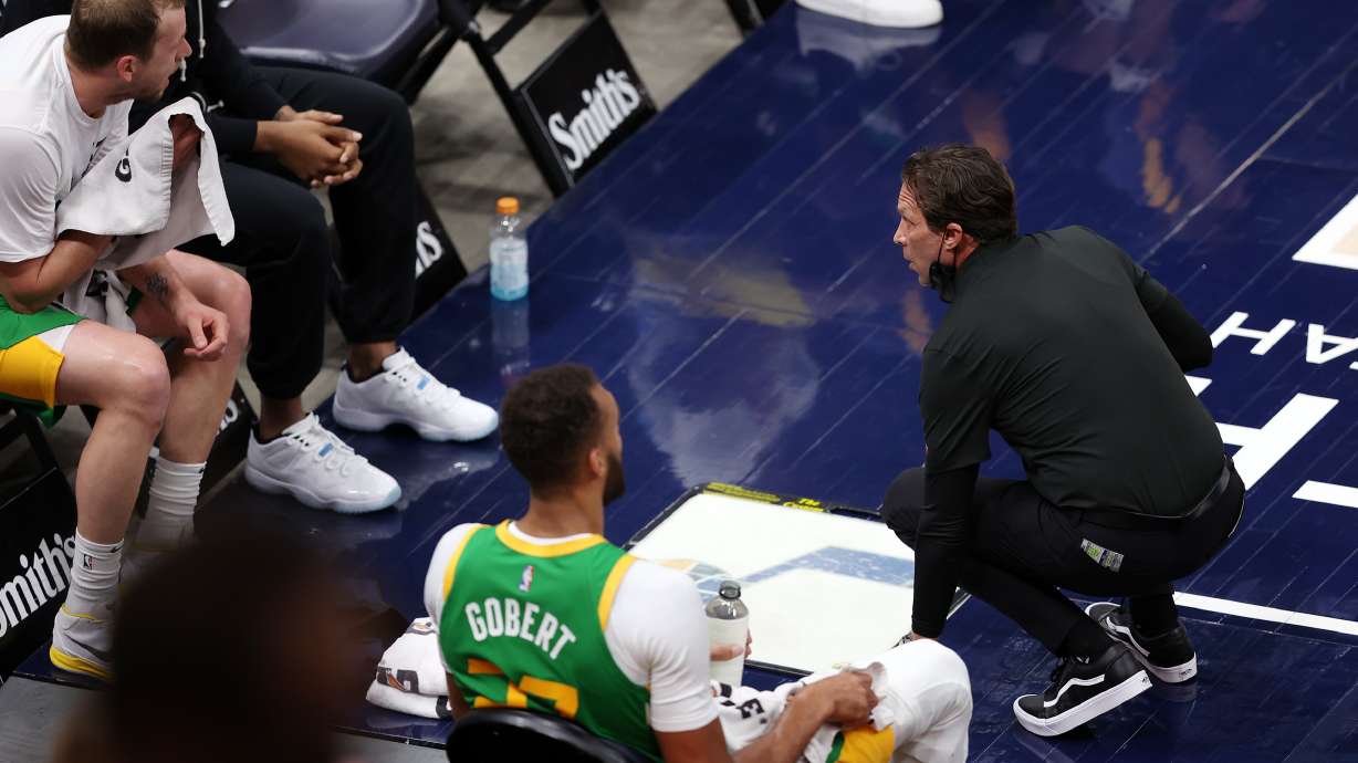 Utah head coach Quin Snyder, right, talks with Utah Jazz guard Joe Ingles (2) as the Utah Jazz and the Denver Nuggets play an NBA basketball game at Vivint Arena in Salt Lake City on Friday, May 7, 2021.