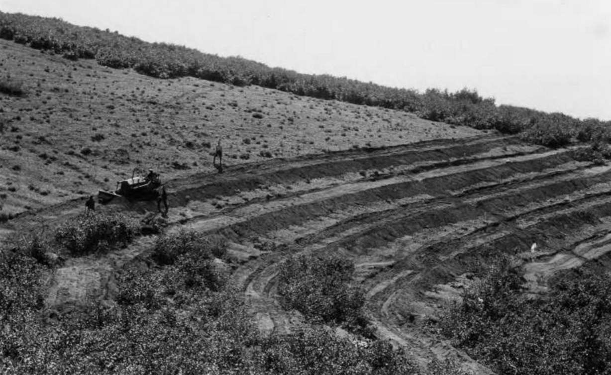 CCC crews work on building terrace trench about 11 miles east of Bountiful sometime in the mid- to late 1930s. The terraces were built to control and prevent floods in the valleys.