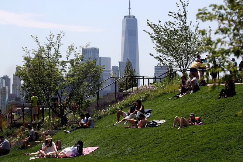 People visit Little Island Park, almost three acres of new public park space which sits on stilts over the Hudson River and the remnants of Pier 54 in the larger Hudson River Park, on Manhattan's West Side, during the park's opening day in New York City, New York, U.S., May 21, 2021. REUTERS/Mike Segar