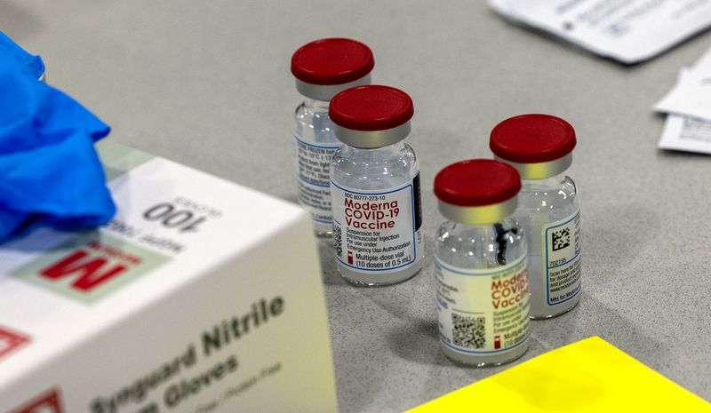 Vials of Moderna’s COVID-19 vaccines sit on a table at
the Mountain America Exposition Center in Sandy on Tuesday, May 18,
2021.