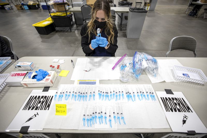 Registered nurse Jessica Hack prepares a Moderna COVID-19 vaccine at the Mountain America Exposition Center in Sandy on Tuesday, May 18, 2021. (Photo: Scott G Winterton, Deseret News )