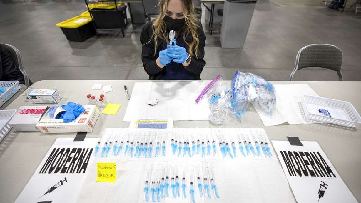 Registered nurse Jessica Hack prepares a Moderna COVID-19 vaccine at the Mountain America Exposition Center in Sandy on Tuesday, May 18, 2021. (Photo: Scott G Winterton, Deseret News )