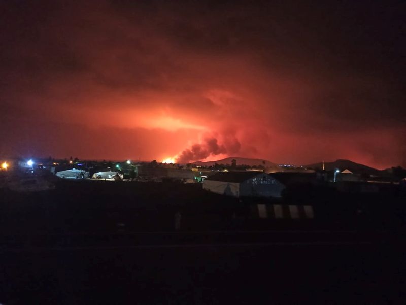 A general view from the Goma International Airport shows smoke and flames at the volcanic eruption of Mount Nyiragongo near Goma, in the Democratic Republic of Congo May 22, 2021. Picture taken May 22, 2021.