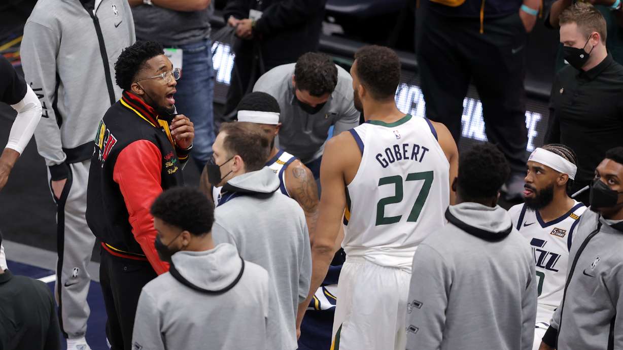 Utah Jazz guard Donovan Mitchell (45) talks to his teammates during a timeout as the Jazz and the Memphis Grizzlies play in Game 1 of their NBA playoff series at Vivint Arena in Salt Lake City on Sunday, May 23, 2021. Memphis won 112-109.