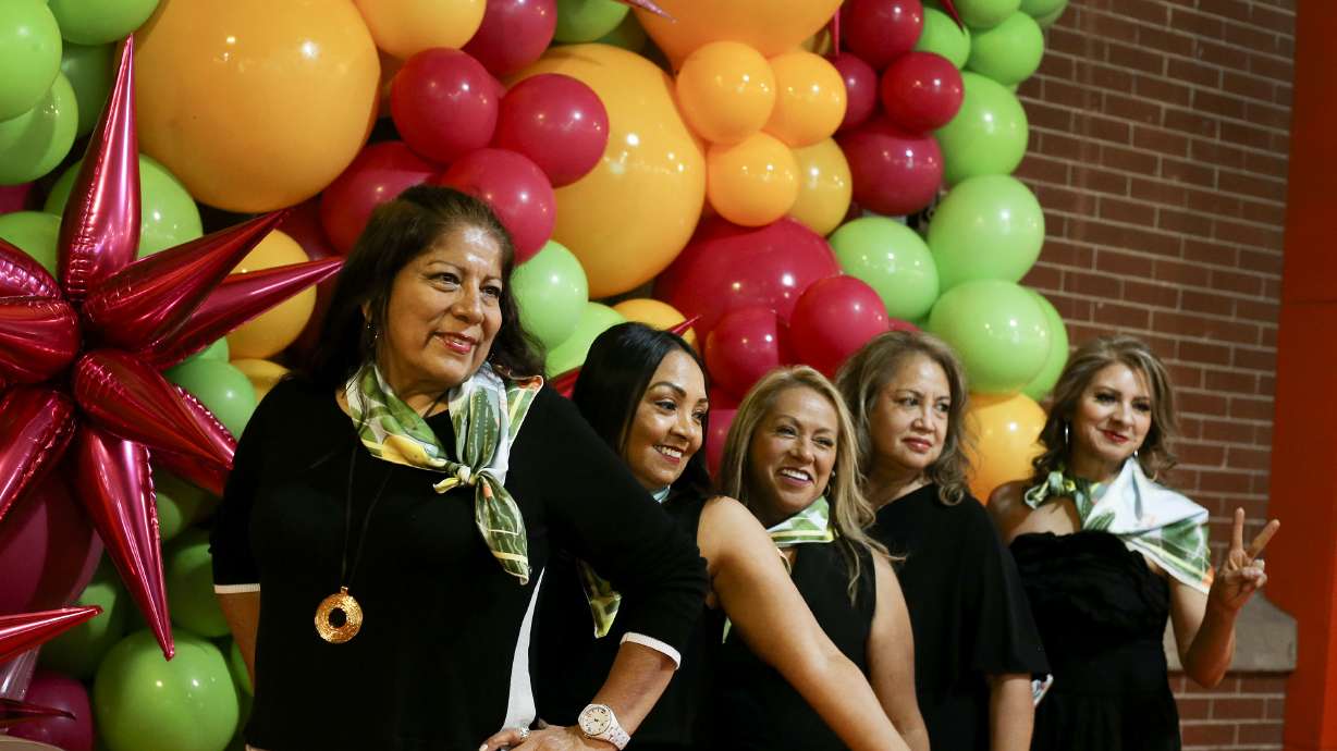 Cancer survivor Nora Serrano, right, Sara Carbajal, health program director for Alliance Community Services, and cancer survivors Beneranda Marquez and Ana Dant take photos during the Utah Latin Runway & Trunkshow at The Gateway in Salt Lake City on Saturday, May 22, 2021. Utah Latin Runway partnered with Alliance Community Services and its cancer survivors support group "Triunfadoras," which provides help to Hispanic women, their families and caregivers. Utah Latin Runway will donate a percentage of ticket sales to Alliance Community Services.