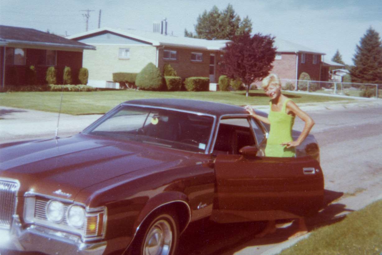Joyce Yost stands next to an early 1970s Mercury Cougar in this undated picture.