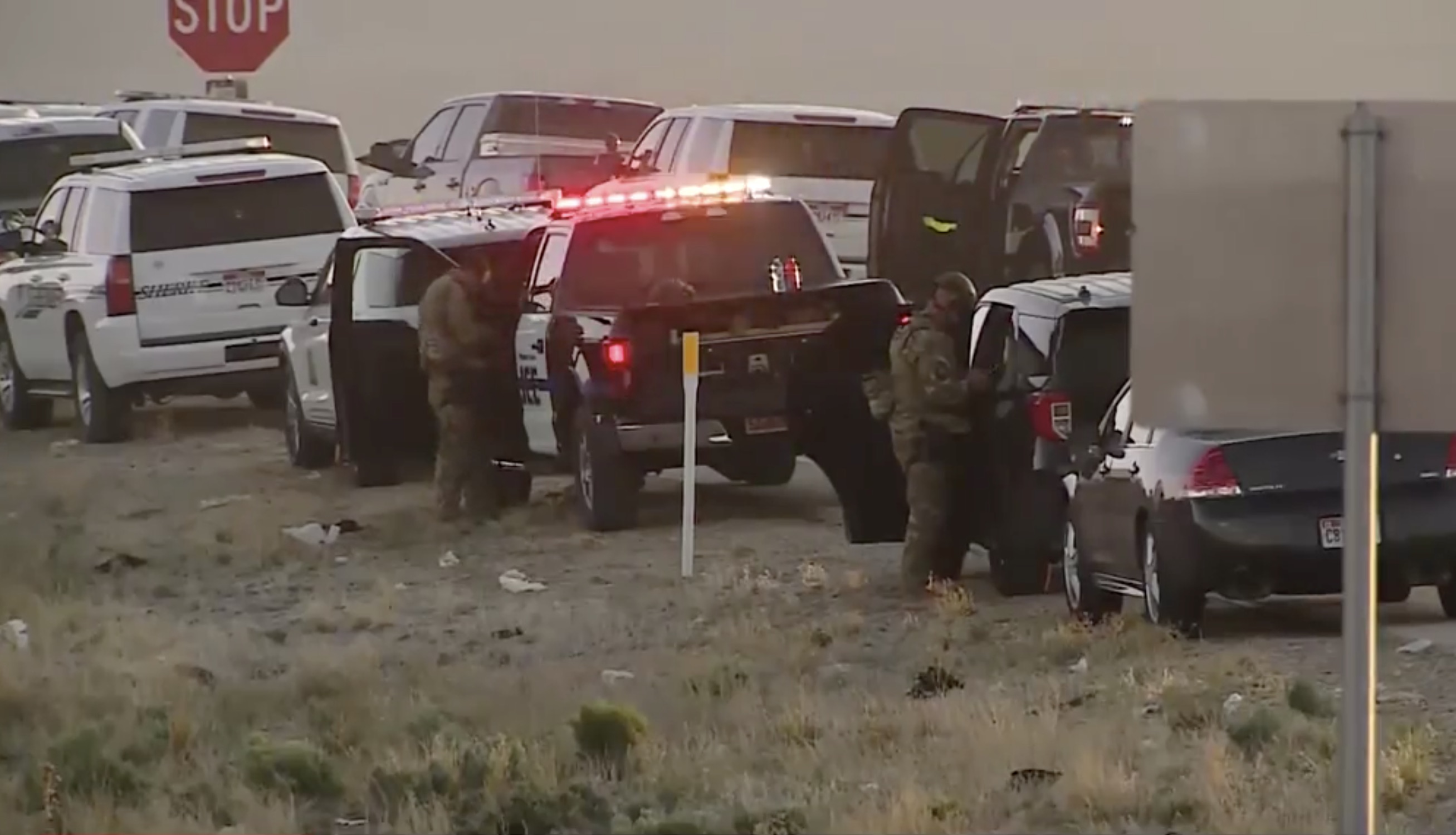 A man was taken into custody Wednesday, May 19, 2021, after he allegedly stole a deputy's SUV and fled in it, causing police to shut down I-15 for hours in both directions during a search that included officers being shot at, officials said.