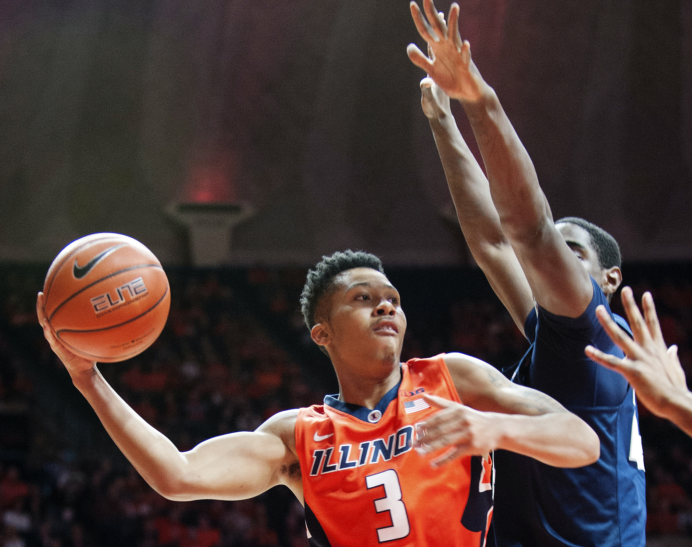 In this Feb. 11, 2017, file photo, Illinois' guard Te'Jon Lucas (3) looks to pass under the basket as Penn State's forward Mike Watkins (24) defends during an NCAA college basketball game in Champaign, Ill. After one season at Milwaukee, Lucas will spend his final season of college basketball at BYU.