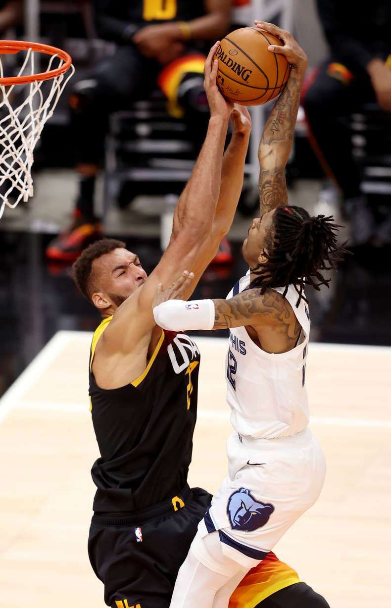 Utah Jazz center Rudy Gobert (27) blocks Memphis Grizzlies guard Ja Morant (12) at the hoop as the Utah Jazz and Memphis Grizzlies play Game 2 of their NBA playoffs first round series at Vivint Arena in Salt Lake City on Wednesday, May 26, 2021.