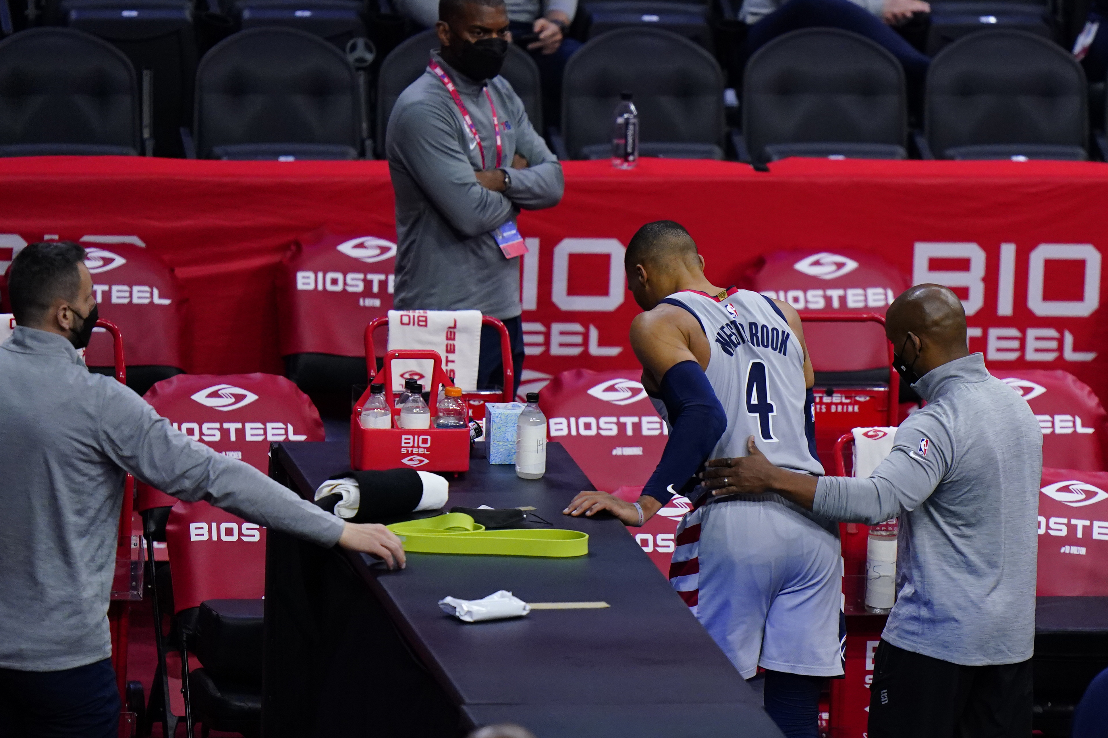 Washington Wizards' Russell Westbrook (4) is helped to the locker room after an injury during the second half of Game 2 in a first-round NBA basketball playoff series against the Philadelphia 76ers, Wednesday, May 26, 2021, in Philadelphia.