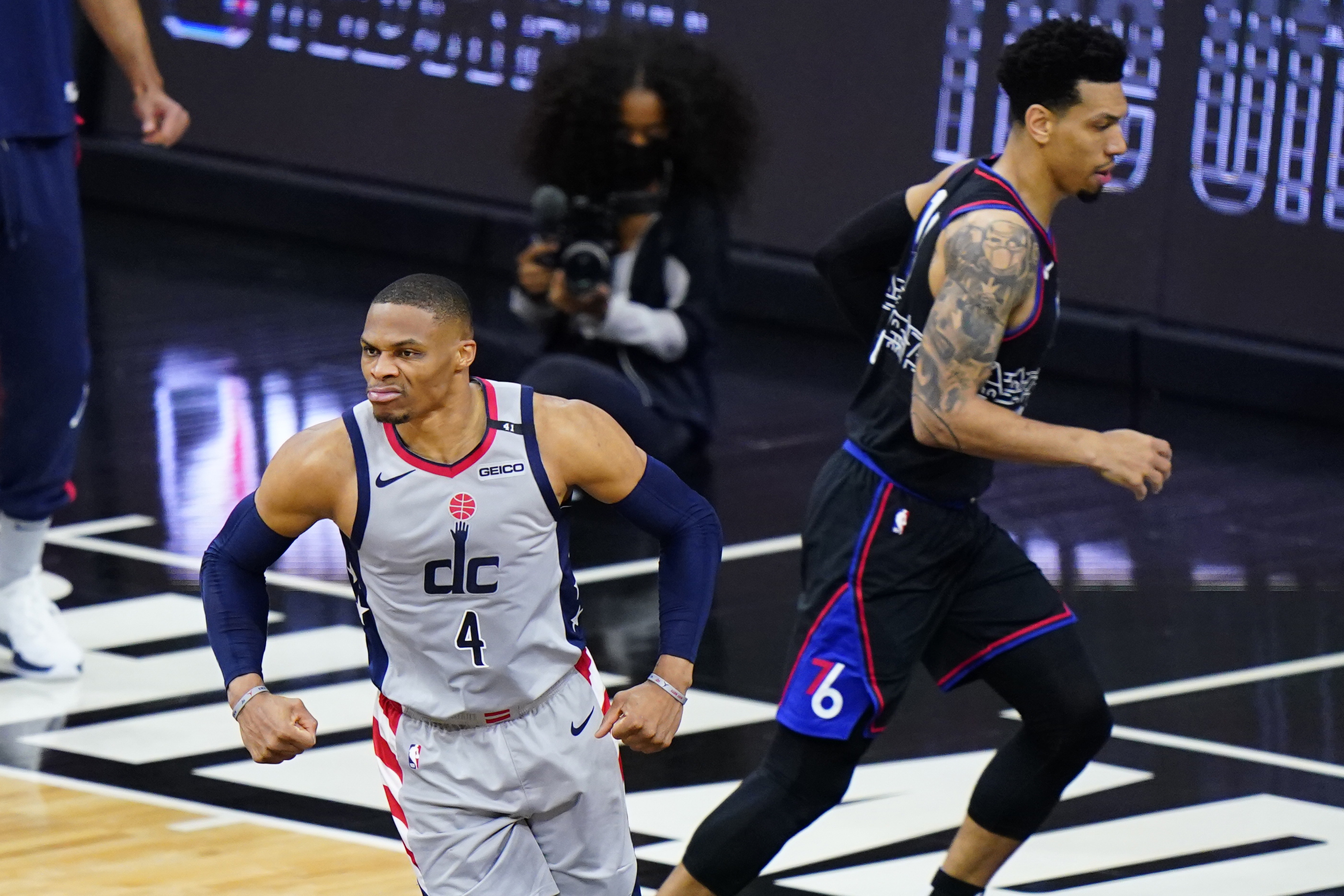 Washington Wizards' Russell Westbrook, left, reacts past Philadelphia 76ers' Danny Green after a dunk during the first half of Game 2 in a first-round NBA basketball playoff series, Wednesday, May 26, 2021, in Philadelphia. (AP Photo/Matt Slocum) [May-27-2021]