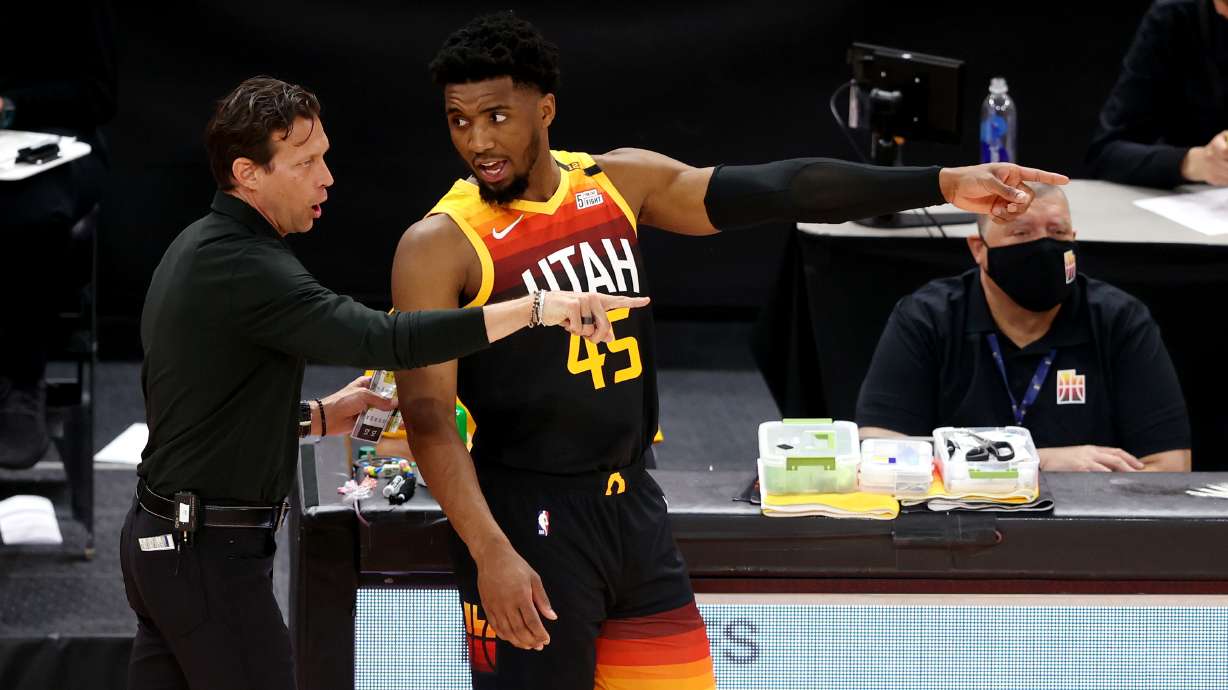 Utah Jazz head coach Quin Snyder talks with Utah Jazz guard Donovan Mitchell (45) as the Utah Jazz and Memphis Grizzlies play Game 2 of their NBA playoffs first round series at Vivint Arena in Salt Lake City on Wednesday, May 26, 2021.