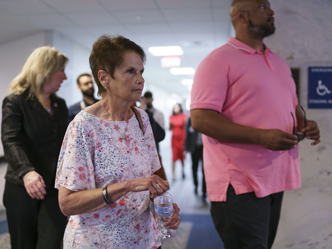 Gladys Sicknick, mother of Brian Sicknick, the Capitol
Police officer who died following the Jan. 6 mob attack on
Congress, leaves a meeting with Republican Sen. Ron Johnson of
Wisconsin after advocating for creation of an independent
commission to investigate the assault, at the Capitol in
Washington, Thursday, May 27, 2021. She is escorted by Harry Dunn,
right, a U.S. Capitol Police officer who faced the rioters on Jan.
6.