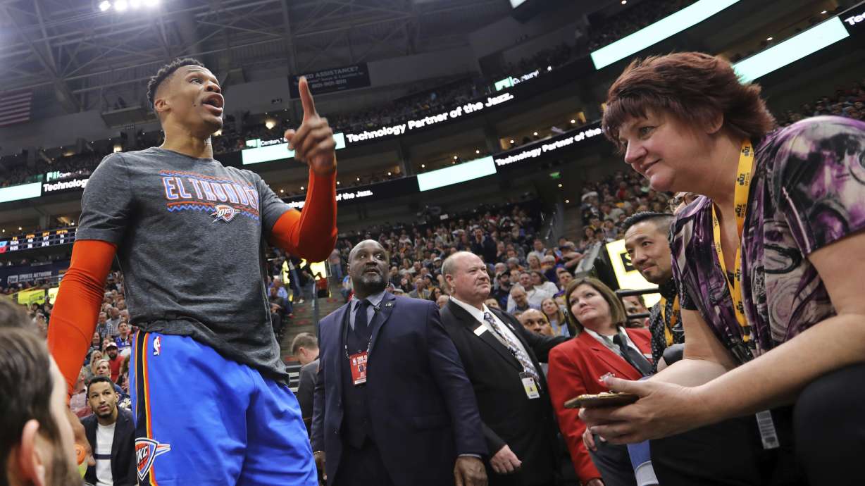 FILE - In this March 11, 2019, file photo, Oklahoma City Thunder's Russell Westbrook gets into a heated verbal altercation with fans in the first half of an NBA basketball game against the Utah Jazz, in Salt Lake City. The lawsuit against the Utah Jazz by a fan who was banned for life from the team's arena over what were called racial taunts directed at Westbrook was dismissed, according to court documents filed Thursday, May 27, 2021. (AP Photo/Rick Bowmer, File)