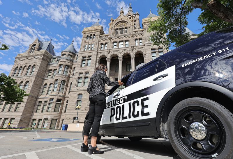 Salt Lake City Mayor Erin Mendenhall talks with Joe
McBride, president of the Salt Lake Police Association, outside of
the City-County Building on Wednesday, May 26, 2021.