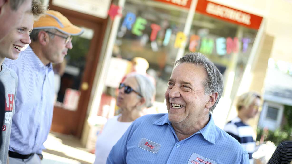 Bobby Rose, owner of 3rd Ave Car Clinic, speaks with friends at his retirement party in Salt Lake City on Thursday, May 27, 2021. Rose is retiring and closing his auto repair shop after 34-plus years.