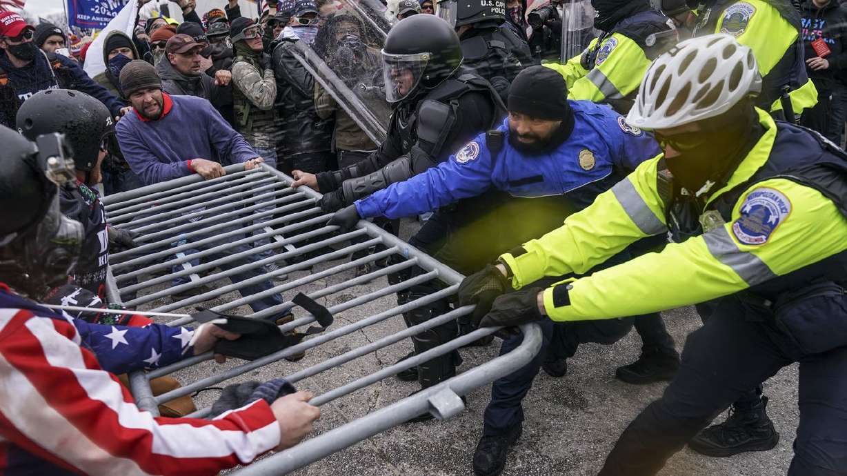 Trump supporters beset a police barrier at the Capitol
in Washington on Wednesday Jan. 6, 2021, A 19th person from Ohio
has been arrested in Alabama for allegedly convening a caravan of
people from Virginia to Washington on Jan. 6 and assaulting police
officers during the deadly Capitol riots.