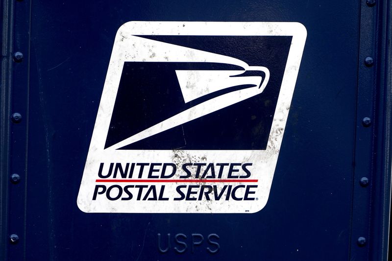 FILE PHOTO: A U.S. Postal Service (USPS) logo is pictured on a mail box in the Manhattan borough of New York City, New York, U.S., August 21, 2020. REUTERS/Carlo Allegri/File Photo