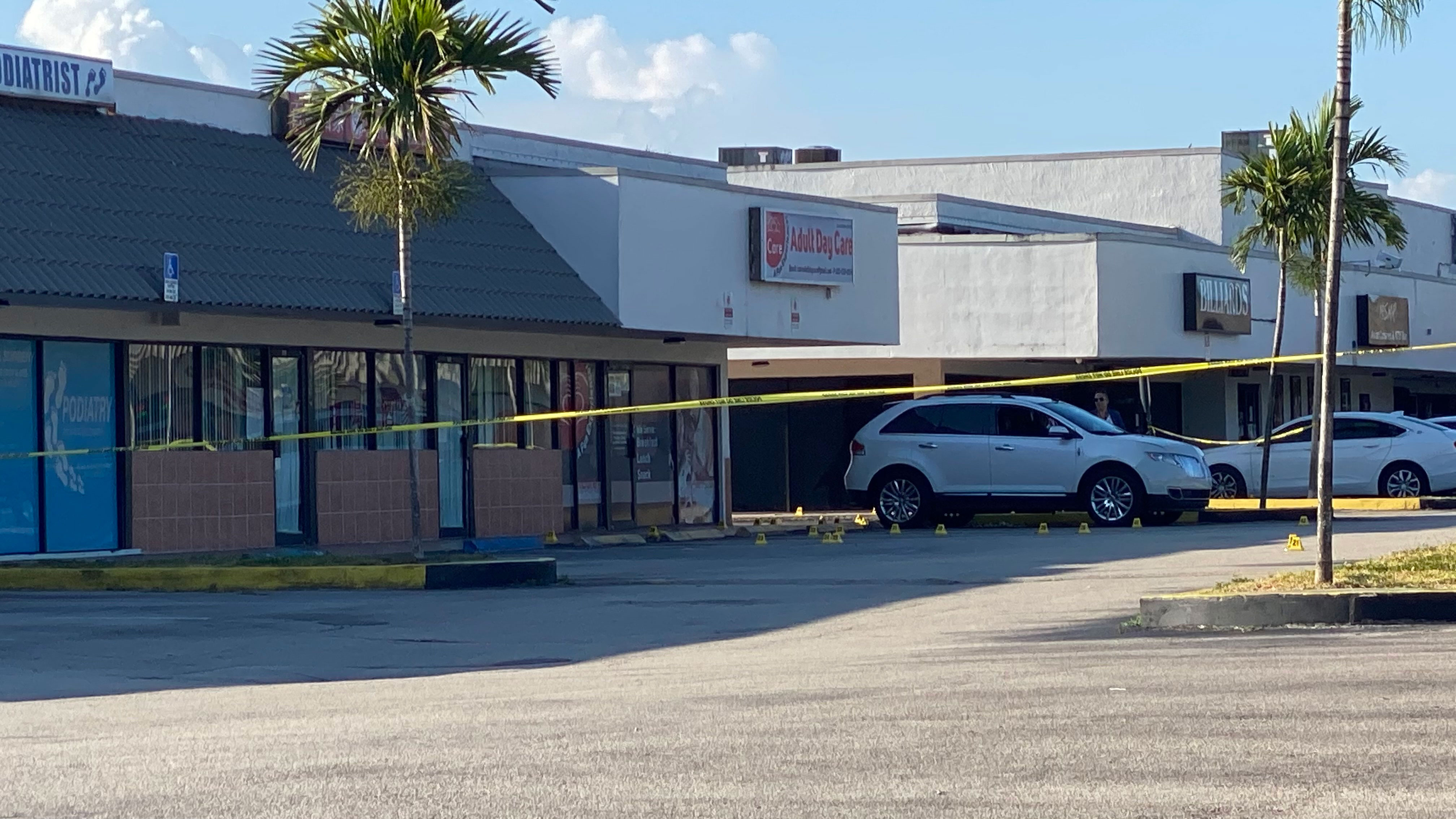 Police tape blocks the scene of a shooting near a Billiard's club that was rented for a concert after three gunmen killed two people and injured 20 overnight in the Hialeah area of Miami Dade county on May 30 2021. (Photo by Eric BARADAT / AFP) (Photo by ERIC BARADAT/AFP via Getty Images)