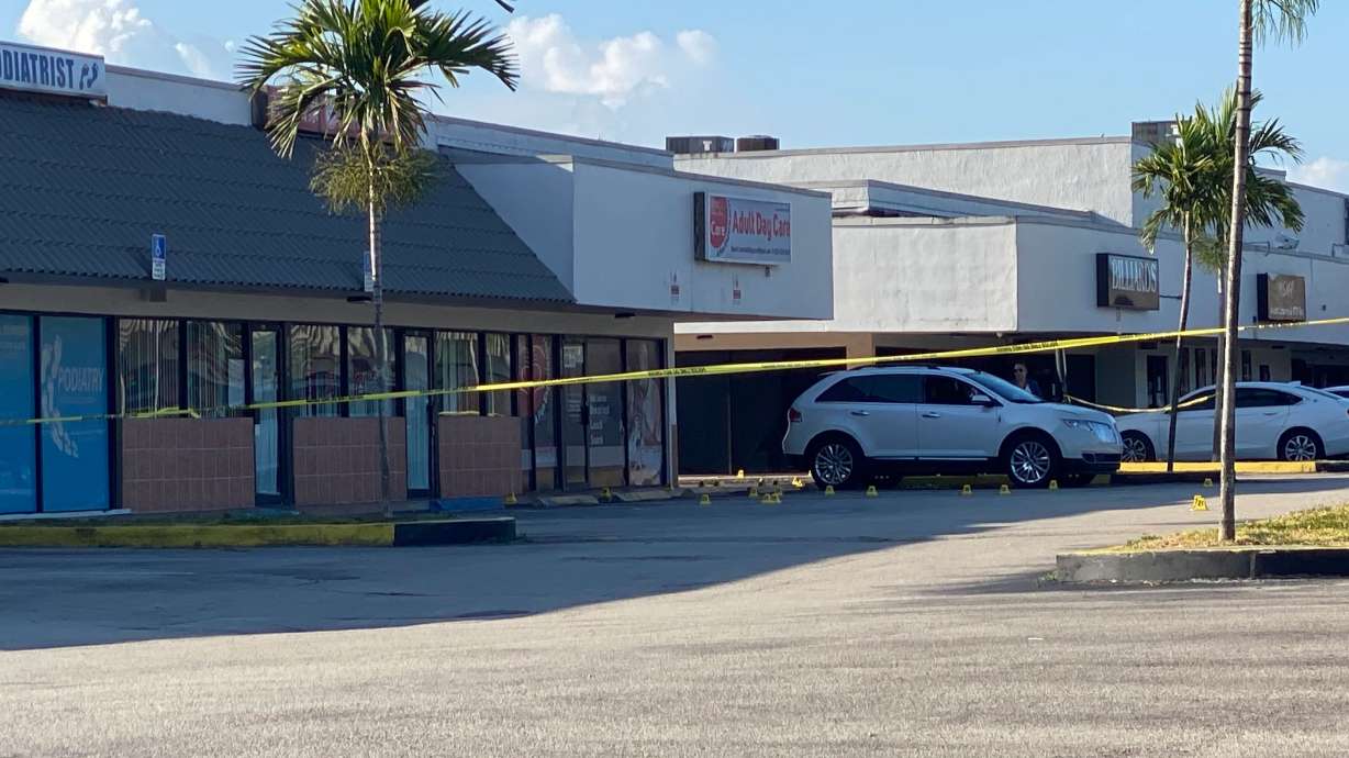Police tape blocks the scene of a shooting near a Billiard's club that was rented for a concert after three gunmen killed two people and injured 20 overnight in the Hialeah area of Miami Dade county on May 30 2021. (Photo by Eric BARADAT / AFP) (Photo by ERIC BARADAT/AFP via Getty Images)